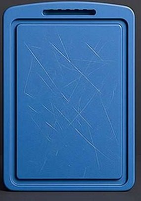 Plastic cutting board scratched from knife use