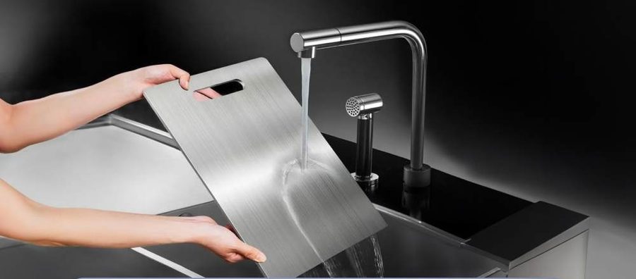 Katori cutting board being rinsed under running water